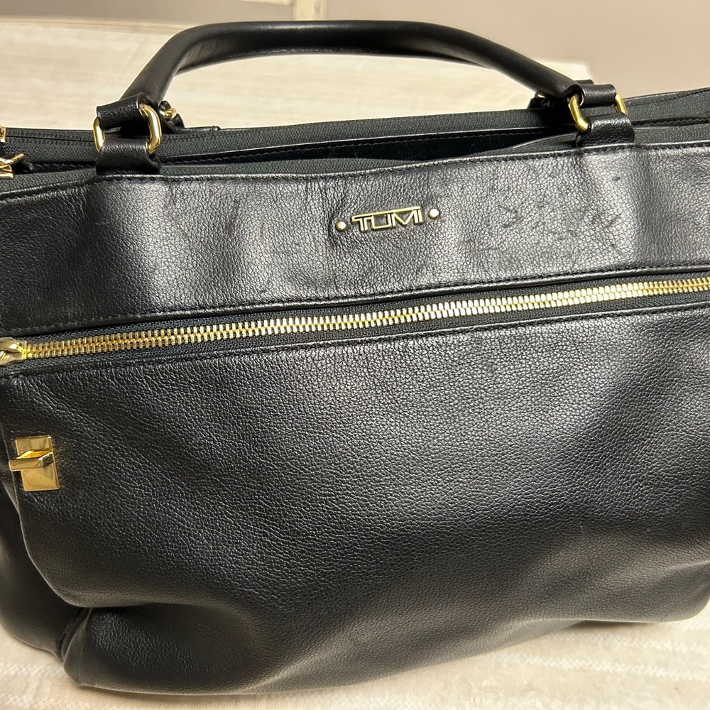 Well love leather Tumi womens bag